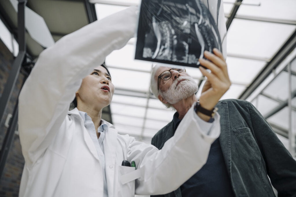 Doctor discussing health screening results with a patient